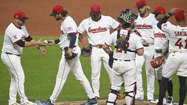 Aug 16, 2025; Cleveland, Ohio, USA; Cleveland Guardians manager Stephen Vogt (12) takes the ball from starting pitcher Slade Cecconi (44) during a pitching change in the fifth inning against the Atlanta Braves at Progressive Field. Mandatory Credit: David Richard-Imagn Images Aug 16, 2025; Cleveland, Ohio, USA; Cleveland Guardians manager Stephen Vogt (12) takes the ball from starting pitcher Slade Cecconi (44) during a pitching change in the fifth inning against the Atlanta Braves at Progressive Field. Mandatory Credit: David Richard-Imagn Images