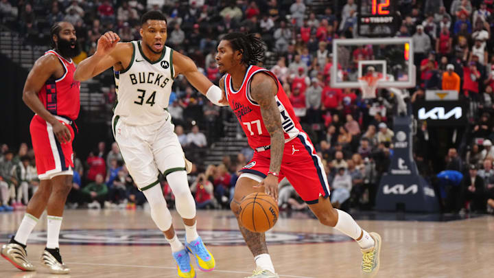 Jan 25, 2025; Inglewood, California, USA; LA Clippers guard Kevin Porter Jr. (77) dribbles the ball against Milwaukee Bucks forward Giannis Antetokounmpo (34) in the first half at Intuit Dome. Mandatory Credit: Kirby Lee-Imagn Images