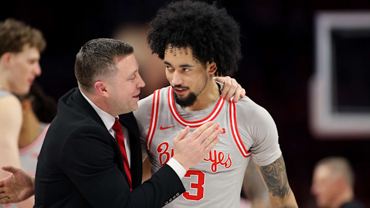 Mar 7, 2026; Columbus, Ohio, USA; Ohio State Buckeyes guard Taison Chatman (3) celebrates with head coach Jake Diebler during the first half against the Indiana Hoosiers at Value City Arena. Mandatory Credit: Joseph Maiorana-Imagn Images