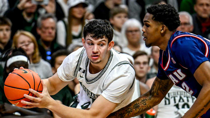 Michigan State's Frankie Fidler, left, looks for room as Florida Atlantic's Devin Vanterpool defends during the second half on Saturday, Dec. 21, 2024, in East Lansing.