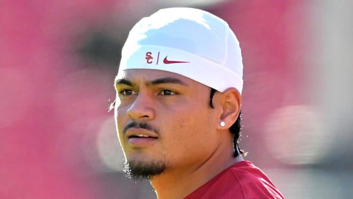 Oct 11, 2025; Los Angeles, California, USA;  USC Trojans quarterback Jayden Maiava (14) warms up prior to the game against the Michigan Wolverines at United Airlines Field at the Los Angeles Memorial Coliseum. Mandatory Credit: Jayne Kamin-Oncea-Imagn Images