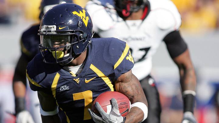 November 13, 2010; Morgantown,WV, USA: West Virginia Mountaineers running back Noel Devine (7) rushes the ball in the third quarter against the Cincinnati Bearcats at Mountaineer Field at Milan Puskar Stadium. WVU defeated Cincinnati 37-10. Mandatory Credit: Charles LeClaire-USPRESSWIRE