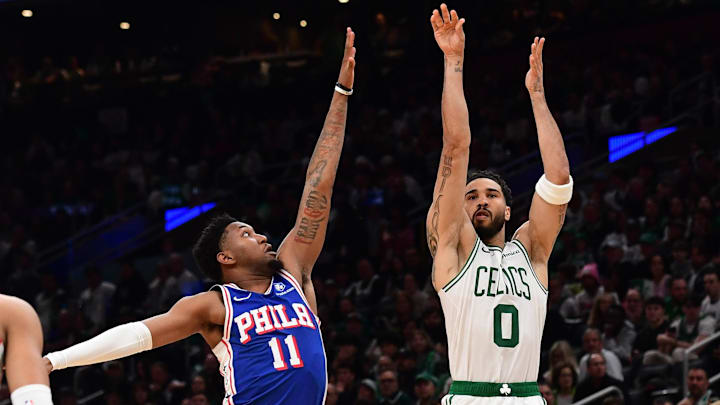 Apr 19, 2026; Boston, Massachusetts, USA; Boston Celtics forward Jayson Tatum (0) shoots the ball past Philadelphia 76ers forward Justin Edwards (11) in the second half during game one of the first round of the 2026 NBA Playoffs at TD Garden. Mandatory Credit: Bob DeChiara-Imagn Images