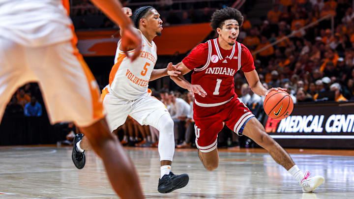 Indiana point guard Myles Rice drives past Tennessee's Zakai Zeigler.