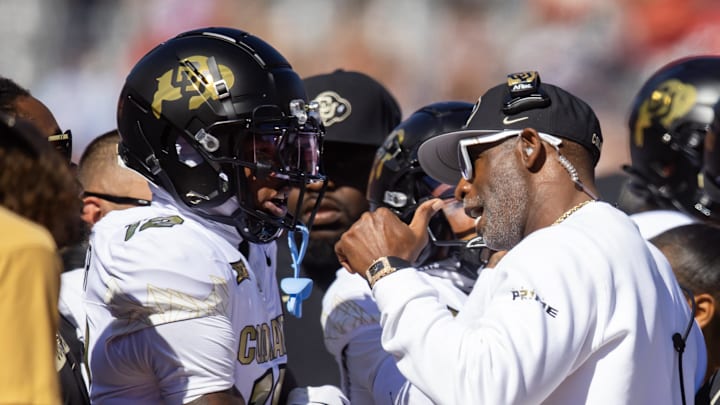 Colorado Buffalos wide receiver Travis Hunter (12) with head coach Deion Sanders against the Arizona Wildcats at Arizona Stadium.