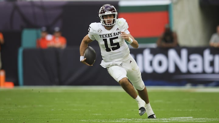 Sep 9, 2023; Miami Gardens, Florida, USA; Texas A&M Aggies quarterback Conner Weigman (15) runs