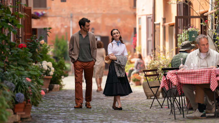 Emily in Paris. (L to R) Eugenio Franceschini as Marcello, Lily Collins as Emily in episode 410 of Emily in Paris. Cr. Giulia Parmigiani/Netflix © 2024