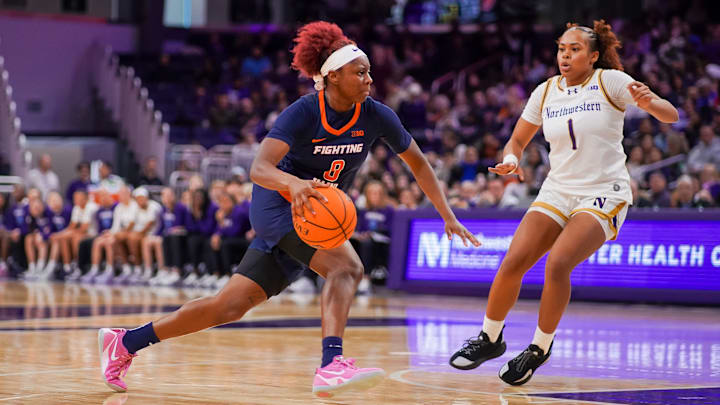 Illinois' Jasmine Brown-Haggar (8) drives against Northwestern's Xamiya Walton (1) in the Illini's 92-65 win over the Wildcats on Sunday at Welsh-Ryan Arena in Evanston, Illinois. Illinois' Jasmine Brown-Haggar (8) drives against Northwestern's Xamiya Walton (1) in the Illini's 92-65 win over the Wildcats on Sunday at Welsh-Ryan Arena in Evanston, Illinois.