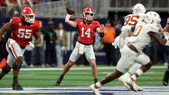 Dec 7, 2024; Atlanta, GA, USA; Georgia Bulldogs quarterback Gunner Stockton (14) drops back to pass against the Texas Longhorns during the second half in the 2024 SEC Championship game at Mercedes-Benz Stadium. Mandatory Credit: Brett Davis-Imagn Images