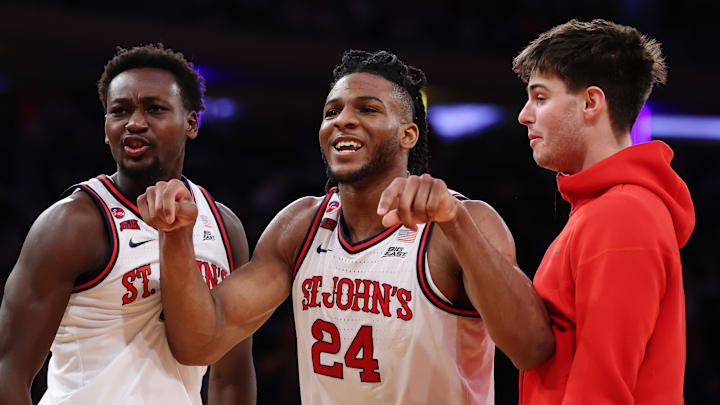 Marquette v St. John's; St. John's basketball center Zuby Ejiofor with forwards Sadiku Ibine Ayo and Brady Dunlap