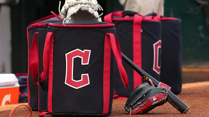 Mar 30, 2024; Oakland, California, USA; Cleveland Guardians equipment sits in front of the dugout before the game against the Oakland Athletics at Oakland-Alameda County Coliseum. Mandatory Credit: Darren Yamashita-Imagn Images