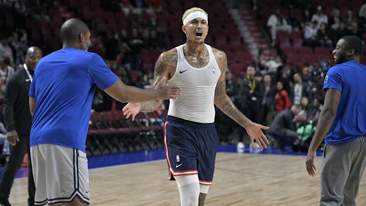 Oct 6, 2024; Montreal, Quebec, CAN; Washington Wizards small forward Kyle Kuzma (33) reacts after making a trick shot before the game against the Toronto Raptors at the Bell Centre.