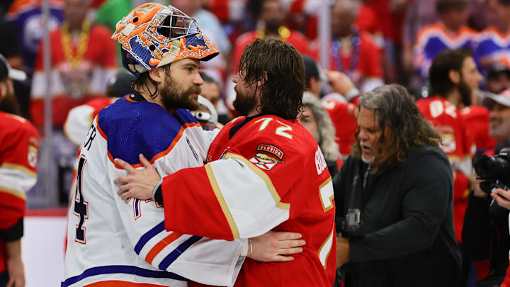 Jun 24, 2024; Sunrise, Florida, USA; Edmonton Oilers goaltender Stuart Skinner (74) and Florida Panthers goaltender Sergei Bobrovsky (72) talk after game seven of the 2024 Stanley Cup Final at Amerant Bank Arena. Mandatory Credit: Sam Navarro-Imagn Images