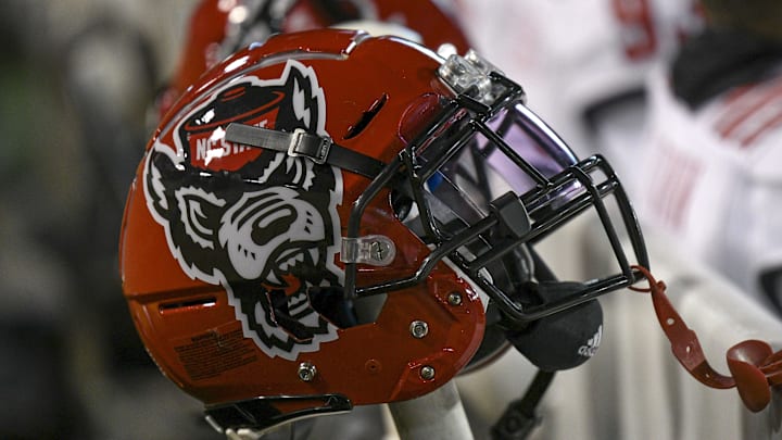 Nov 13, 2021; Winston-Salem, North Carolina, USA; A North Carolina State Wolfpack helmet seen on the sideline during the second half against the Wake Forest Demon Deacons at Truist Field. Mandatory Credit: William Howard-Imagn Images