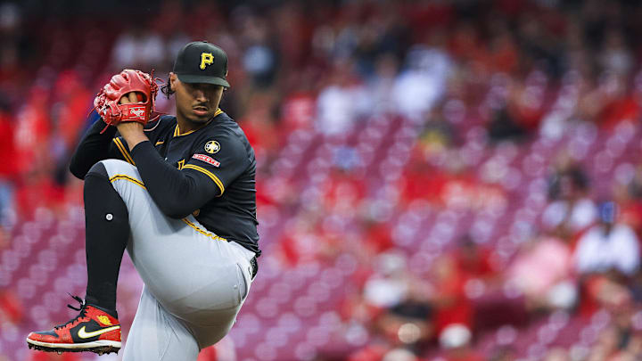 Sep 23, 2025; Cincinnati, Ohio, USA; Pittsburgh Pirates starting pitcher Johan Oviedo (24) pitches against the Cincinnati Reds in the first inning at Great American Ball Park. Mandatory Credit: Katie Stratman-Imagn Images