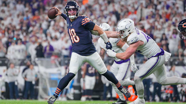 Caleb Williams gets off a pass with Andrew Van Ginkel applying pressure for the Vikings.