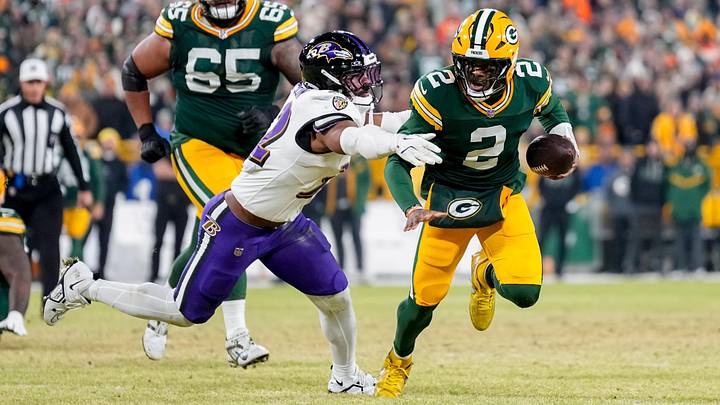 Dec 27, 2025; Green Bay, Wisconsin, USA; Baltimore Ravens linebacker Trenton Simpson (32) tackles Green Bay Packers quarterback Malik Willis (2) during the third quarter at Lambeau Field. Mandatory Credit: Jeff Hanisch-Imagn Images Dec 27, 2025; Green Bay, Wisconsin, USA; Baltimore Ravens linebacker Trenton Simpson (32) tackles Green Bay Packers quarterback Malik Willis (2) during the third quarter at Lambeau Field. Mandatory Credit: Jeff Hanisch-Imagn Images