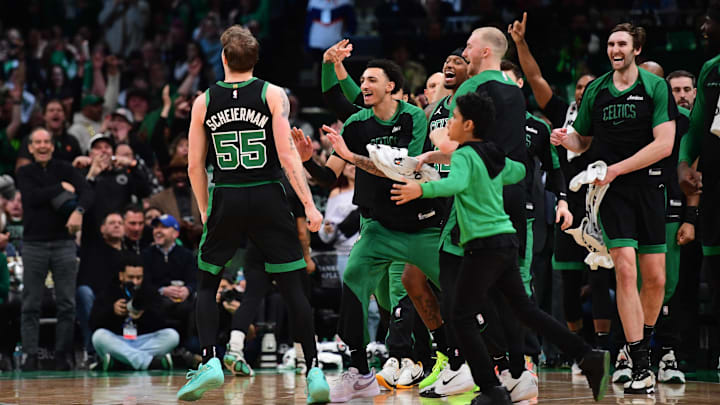 Mar 18, 2025; Boston, Massachusetts, USA; Boston Celtics forward Baylor Scheierman (55) reacts with the bench after hitting a three point shot during the second half at TD Garden. Mandatory Credit: Bob DeChiara-Imagn Images