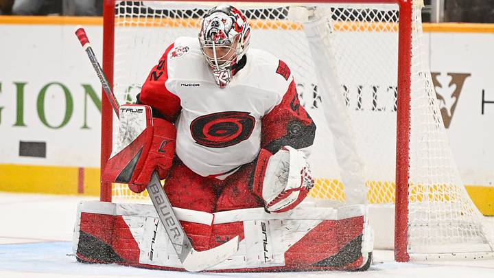Dec 17, 2025; Nashville, Tennessee, USA; Carolina Hurricanes goaltender Pyotr Kochetkov (52) stops the puck against the Nashville Predators during the third period at Bridgestone Arena. Mandatory Credit: Steve Roberts-Imagn Images