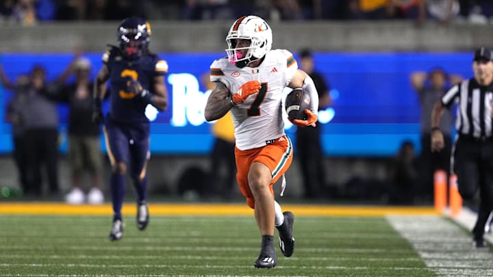 Oct 5, 2024; Berkeley, California, USA; Miami Hurricanes wide receiver Xavier Restrepo (7) runs after a catch against the California Golden Bears during the fourth quarter at California Memorial Stadium. Mandatory Credit: Darren Yamashita-Imagn Images