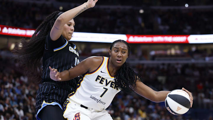 Jun 7, 2025; Chicago, Illinois, USA; Indiana Fever forward Aliyah Boston (7) drives to the basket against Chicago Sky center Kamilla Cardoso (10) during the first half of a WNBA game at United Center. Mandatory Credit: Kamil Krzaczynski-Imagn Images