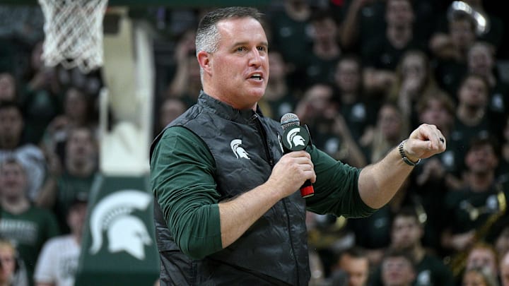 Dec 2, 2025; East Lansing, Michigan, USA; Michigan State head football coach Pat Fitzgerald watches the Spartans defeat the Iowa Hawkeyes at Jack Breslin Student Events Center. Mandatory Credit: Dale Young-Imagn Images Dec 2, 2025; East Lansing, Michigan, USA; Michigan State head football coach Pat Fitzgerald watches the Spartans defeat the Iowa Hawkeyes at Jack Breslin Student Events Center. Mandatory Credit: Dale Young-Imagn Images