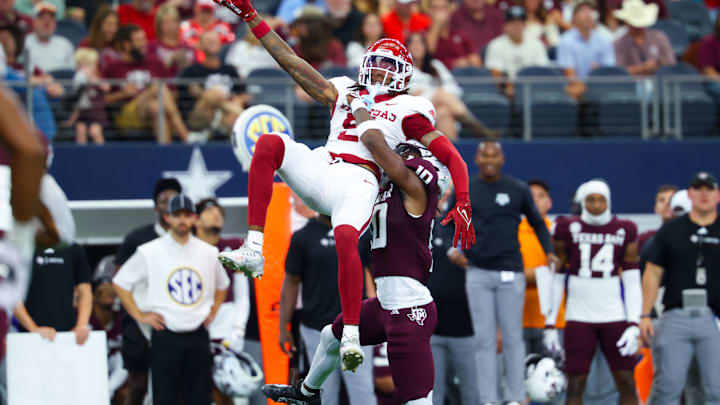 Arkansas Razorbacks wide receiver Tyrone Broden cannot catch a ball as Texas A&M Aggies defensive back Dezz Ricks