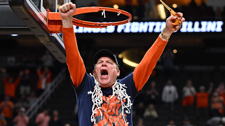 Mar 28, 2026; Houston, TX, USA; Illinois Fighting Illini head coach Brad Underwood celebrates after cutting down the net after defeating the Iowa Hawkeyes in an Elite Eight game of the South Regional of the men's 2026 NCAA Tournament at Toyota Center. Mandatory Credit: Maria Lysaker-Imagn Images