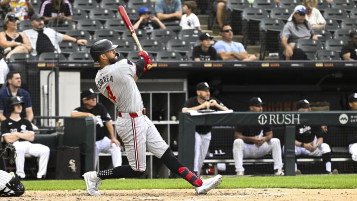 Jul 10, 2024; Chicago, Illinois, USA;  Minnesota Twins shortstop Carlos Correa (4) hits a home run against the Chicago White Sox during the sixth inning at Guaranteed Rate Field. Mandatory Credit: Matt Marton-USA TODAY Sports