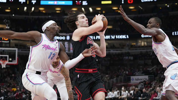Apr 9, 2025; Chicago, Illinois, USA; Miami Heat center Bam Adebayo (13) defends Chicago Bulls guard Josh Giddey (3)