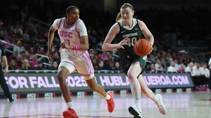 Feb 19, 2025; Los Angeles, California, USA; Michigan State Spartans guard Julia Ayrault (40) dribbles the ball against Southern California Trojans center Rayah Marshall (13) in the second half at the Galen Center. Mandatory Credit: Kirby Lee-Imagn Images Feb 19, 2025; Los Angeles, California, USA; Michigan State Spartans guard Julia Ayrault (40) dribbles the ball against Southern California Trojans center Rayah Marshall (13) in the second half at the Galen Center. Mandatory Credit: Kirby Lee-Imagn Images