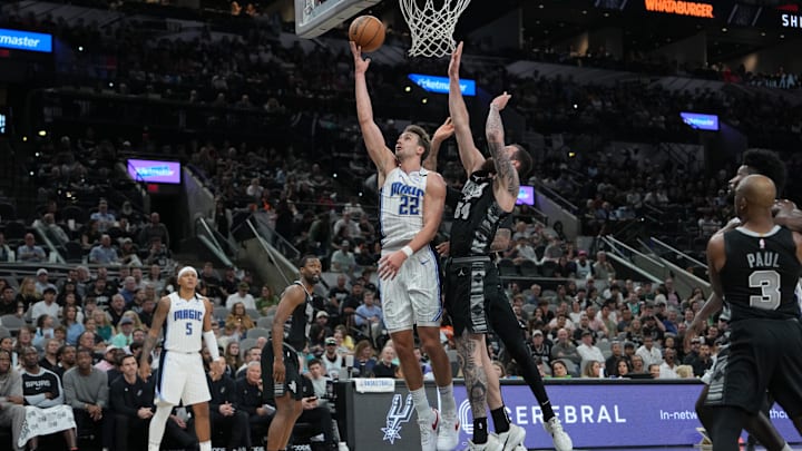 Orlando Magic forward Franz Wagner (22) shoots in front of San Antonio Spurs forward Sandro Mamukelashvili (54) in the second half at Frost Bank Center.