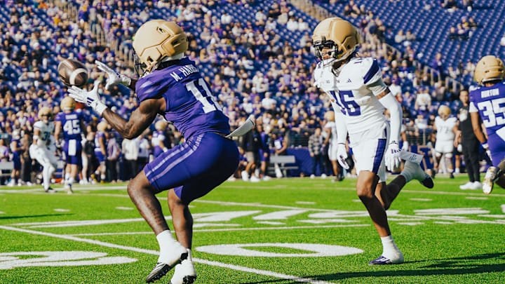 Ramonz Adams (16) comes up on wide receiver Marcus Harris during the UW Spring Game. 