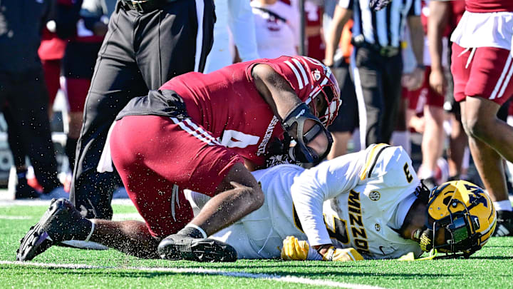 Oct 12, 2024; Amherst, Massachusetts, USA; Missouri Tigers wide receiver Luther Burden III (3) grimaces after being tackled by Massachusetts Minutemen safety Tyler Rudolph (4) during the second half at Warren McGuirk Alumni Stadium. Mandatory Credit: Eric Canha-Imagn Images