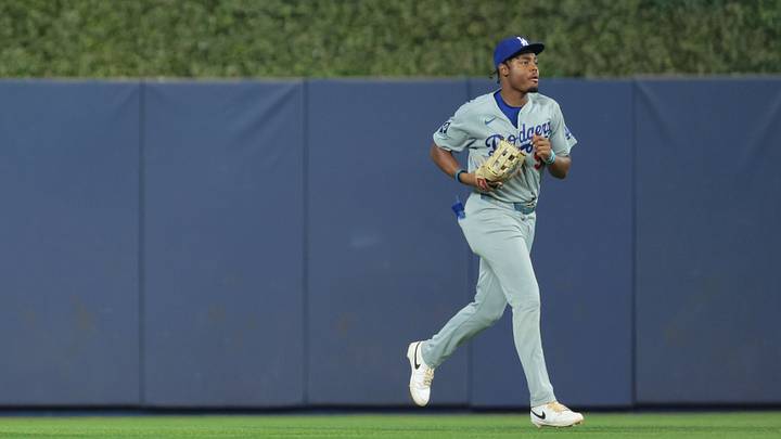 Los Angeles Dodgers right fielder Josue de Paula (95) returns to the dugout against the Miami Marlins after the fourth inning at loanDepot Park in Miami on Sept. 13, 2026. Los Angeles Dodgers right fielder Josue de Paula (95) returns to the dugout against the Miami Marlins after the fourth inning at loanDepot Park in Miami on Sept. 13, 2026.