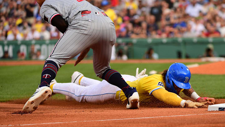 May 3, 2025; Boston, Massachusetts, USA; Boston Red Sox left fielder Jarren Duran (16) slides into third past Minnesota Twins third baseman Brooks Lee (2) during the third inning at Fenway Park. Mandatory Credit: Bob DeChiara-Imagn Images May 3, 2025; Boston, Massachusetts, USA; Boston Red Sox left fielder Jarren Duran (16) slides into third past Minnesota Twins third baseman Brooks Lee (2) during the third inning at Fenway Park. Mandatory Credit: Bob DeChiara-Imagn Images