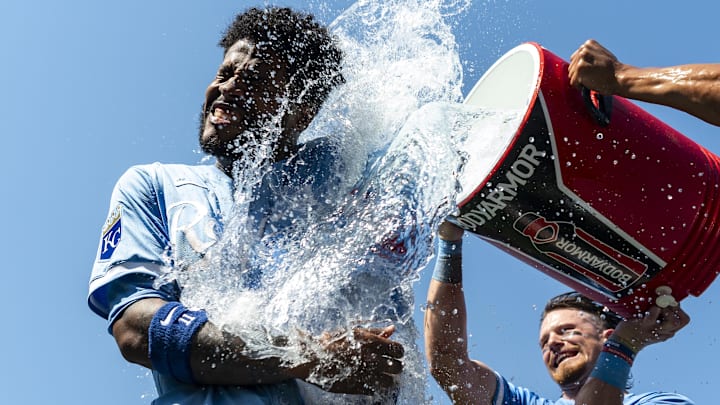 Jun 13, 2024; Kansas City, Missouri, USA; Kansas City Royals third baseman Maikel Garcia (11) is doused with water by shortstop Bobby Witt Jr. (7) and left fielder MJ Melendez (1) after defeating the New York Yankees at Kauffman Stadium. Mandatory Credit: Jay Biggerstaff-Imagn Images