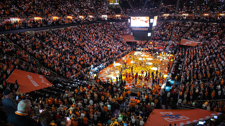 Dec 28, 2019; Knoxville, Tennessee, USA; A sold out crowd stands for player introductions before a game between the Wisconsin Badgers and Tennessee Volunteers at Thompson-Boling Arena. Mandatory Credit: Bryan Lynn-Imagn Images