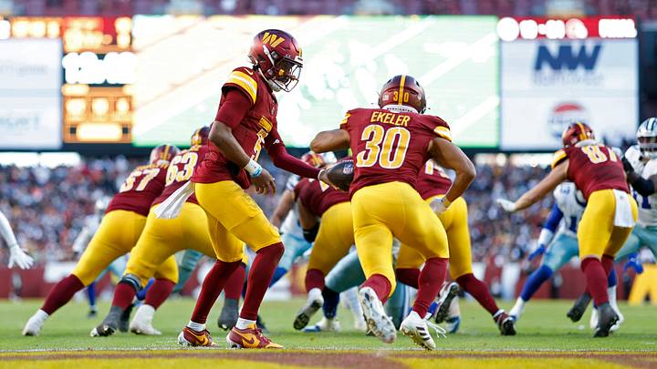 Nov 24, 2024; Landover, Maryland, USA; Washington Commanders quarterback Jayden Daniels (5) hands the ball off to Commanders running back Austin Ekeler (30) against the Dallas Cowboys at Northwest Stadium. Mandatory Credit: Geoff Burke-Imagn Images Nov 24, 2024; Landover, Maryland, USA; Washington Commanders quarterback Jayden Daniels (5) hands the ball off to Commanders running back Austin Ekeler (30) against the Dallas Cowboys at Northwest Stadium. Mandatory Credit: Geoff Burke-Imagn Images