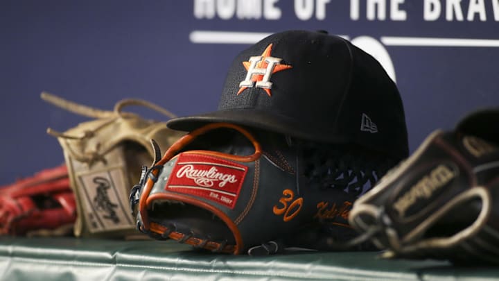 Aug 20, 2022; Atlanta, Georgia, USA; A detailed view of the hat and glove of Houston Astros right fielder Kyle Tucker (not pictured) against the Atlanta Braves in the eleventh inning at Truist Park.