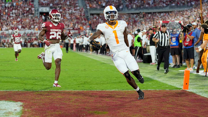 Tennessee Volunteers wide receiver Dont'e Thornton Jr. (1) scores a touchdown in front of Oklahoma Sooners defensive back Kani Walker (26) during a college football game between the University of Oklahoma Sooners (OU) and the Tennessee Volunteers at Gaylord Family - Oklahoma Memorial Stadium in Norman, Okla., Saturday, Sept. 21, 2024.