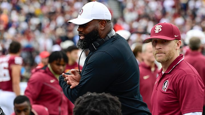 Sep 16, 2023; Chestnut Hill, Massachusetts, USA; Florida State Seminoles offensive coordinator Alex Atkins speaks to the team during the second half against the Boston College Eagles at Alumni Stadium. Mandatory Credit: Eric Canha-Imagn Images