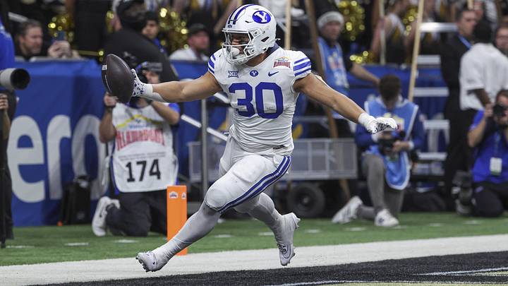 Dec 28, 2024; San Antonio, TX, USA; Brigham Young Cougars running back Sione I Moa (30) scores a touchdown during the third quarter against the Colorado Buffaloes at Alamodome. Mandatory Credit: Troy Taormina-Imagn Images