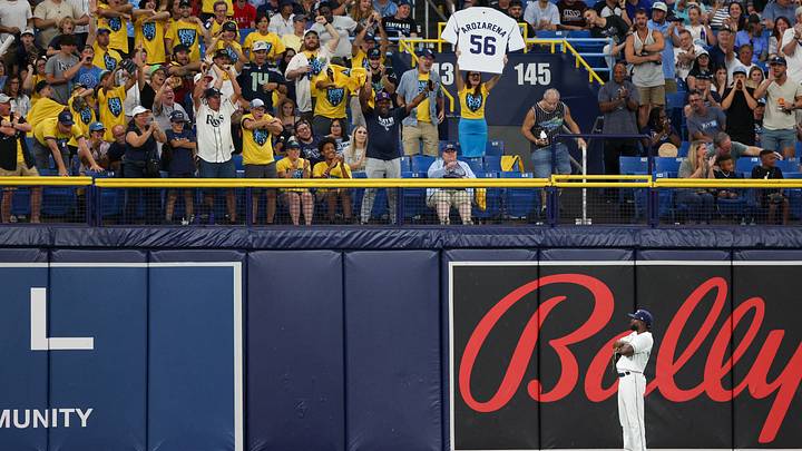 Jun 9, 2023; St. Petersburg, Florida, USA; Tampa Bay Rays left fielder Randy Arozarena (56) reacts with the fans after making a leaping catch at the wall against the Texas Rangers in the sixth inning at Tropicana Field. Mandatory Credit: Nathan Ray Seebeck-USA TODAY Sports Jun 9, 2023; St. Petersburg, Florida, USA; Tampa Bay Rays left fielder Randy Arozarena (56) reacts with the fans after making a leaping catch at the wall against the Texas Rangers in the sixth inning at Tropicana Field. Mandatory Credit: Nathan Ray Seebeck-USA TODAY Sports