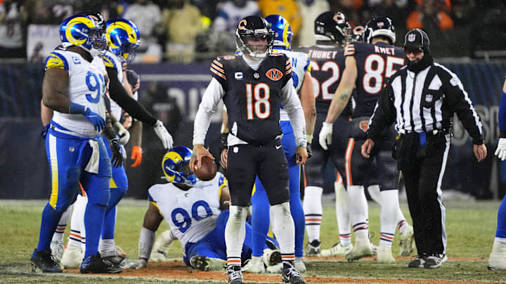 Bears quarterback Caleb Williams emerges with the ball and a first down after a quarterback sneak late in Sunday night's loss.