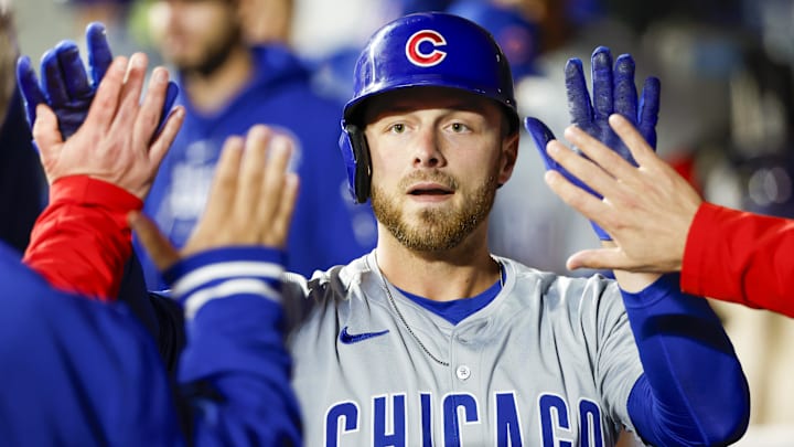 Apr 13, 2024; Seattle, Washington, USA; Chicago Cubs first baseman Michael Busch (29) high-fives