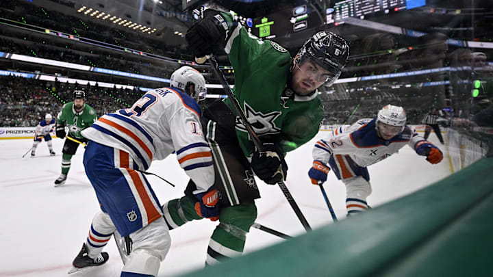 May 29, 2025; Dallas, Texas, USA; Edmonton Oilers center Mattias Janmark (13) checks Dallas Stars defenseman Lian Bichsel (6) during the second period in game five of the Western Conference Final of the 2025 Stanley Cup Playoffs at American Airlines Center. Mandatory Credit: Jerome Miron-Imagn Images