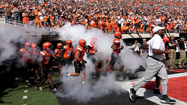 Oklahoma State runs on to the field before the college football game between the Oklahoma State Cowboys and the Baylor Bears at Boone Pickens Stadium in Stillwater, Okla., Saturday, Sept. 27, 2025.