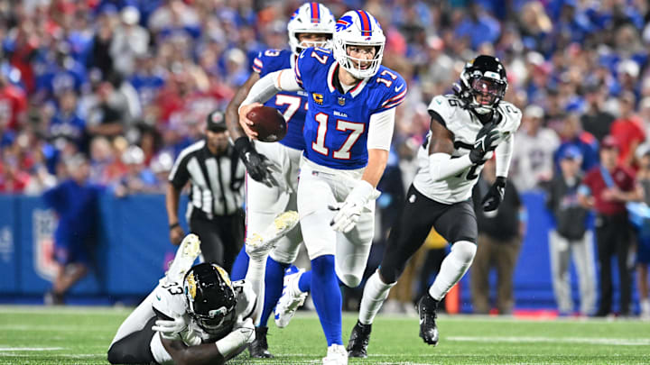 Sep 23, 2024; Orchard Park, New York, USA; Buffalo Bills quarterback Josh Allen (17) runs for a first down against the Jacksonville Jaguars in the second quarter at Highmark Stadium. Sep 23, 2024; Orchard Park, New York, USA; Buffalo Bills quarterback Josh Allen (17) runs for a first down against the Jacksonville Jaguars in the second quarter at Highmark Stadium.