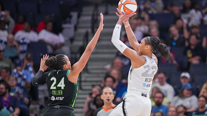 Jul 25, 2025; Minneapolis, Minnesota, USA; Las Vegas Aces center A'ja Wilson (22) shoots against the Minnesota Lynx forward Napheesa Collier (24) in the third quarter at Target Center. Mandatory Credit: Brad Rempel-Imagn Images Jul 25, 2025; Minneapolis, Minnesota, USA; Las Vegas Aces center A'ja Wilson (22) shoots against the Minnesota Lynx forward Napheesa Collier (24) in the third quarter at Target Center. Mandatory Credit: Brad Rempel-Imagn Images